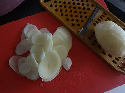slicing potatoes for sun dried potato chips or aloo chips