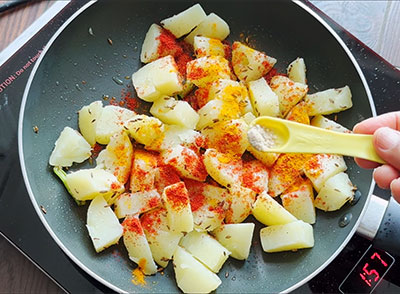 asafoetida, turmeric and red chili for aloo jeera or potato fry recipe