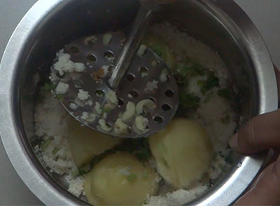 mashing potato for aloo rava fingers or potato sooji snacks