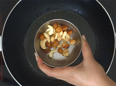 roasting cashew and raisins for avalakki payasa or aval payasam
