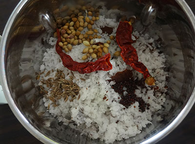 grind coconut and red chili for Baale hoo palya or banana flower stir fry