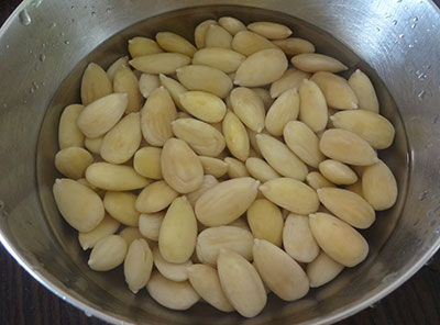 peel and soak the almonds for badam halwa or almond halwa