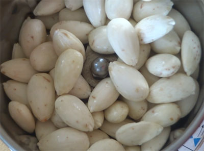 grinding almonds for badam halwa or almond halwa