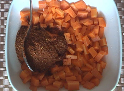 mixing spice powder for carrot pickle or carrot uppinakayi