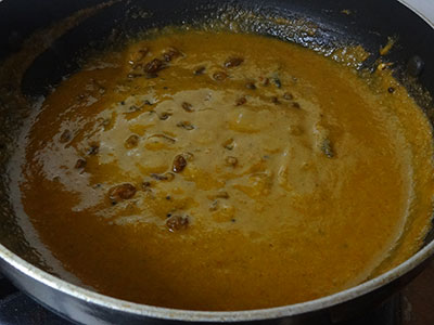 boiling drakshi gojju or raisins curry