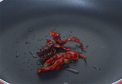 frying red chili for garlic chutney or bellulli chutney