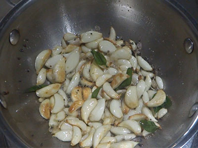 fried garlic cloves for garlic pickle or bellulli uppinakayi