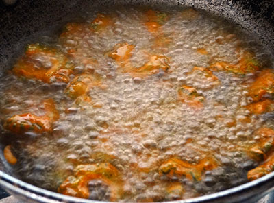 frying hagalakai pakoda or bittergourd chips or karela fry