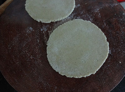 rolling the pooris for mixed flour poori or hittina vade