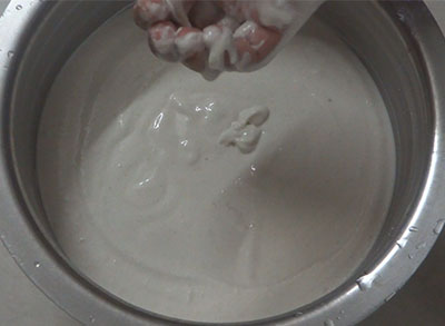 mixing the batter for idli dosa batter using mixie