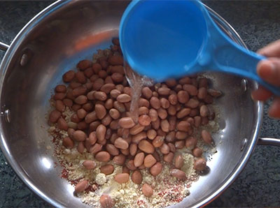 mixing peanuts for masala peanuts or kara kadlekai