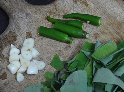garlic and green chilies for kesuvina ele chutney or taro leaves chutney