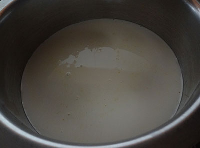 milk in a container for making soft paneer
