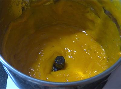 grinding mangoes for mavina hannu happala or aam papad recipe