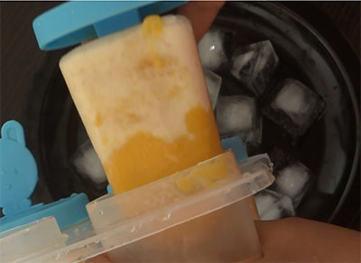 hold the freezed popsicles under running water