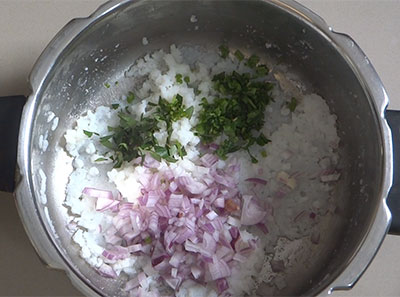 onion, curry leaves and green chili for paddu using leftover rice