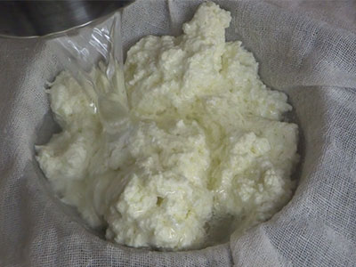 straining curdled milk for paneer bhurji recipe