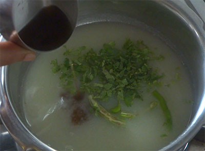 coriander leaves and tamarind juice for potato rasam or alugadde saaru