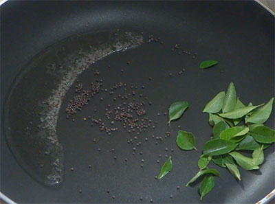 mustard and curry leaves for potato upkari or batata talasani recipe
