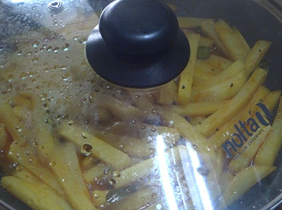 cooking potatoes for potato upkari or batata talasani recipe