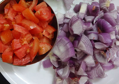 chop onion and tomato for pudina pulao or pudina rice