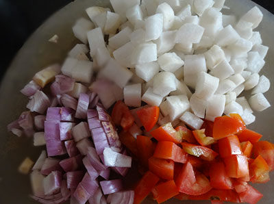 cutting vegetables for radish sambar or moolangi sambar