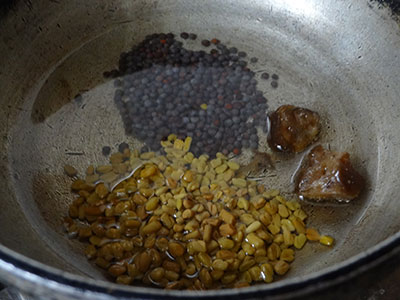 tempering for ranjaka or red chili chutney
