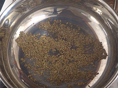 Roasting cumin seeds for jeerige kashaya or gas and indigestion remedy