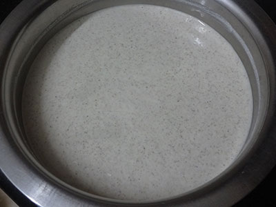 grinding millet and dals for sajje dose or pearl millet dosa