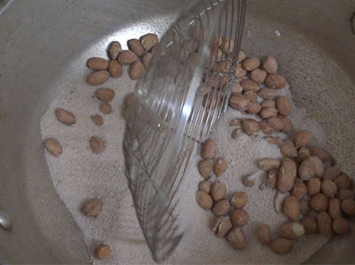 roasting peanuts for home made salted kadelkai or shenga