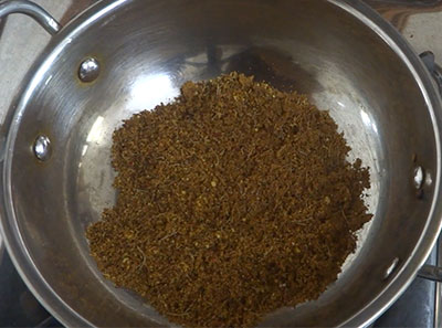 crushing pepper and cumin for shunti saaru or ginger rasam