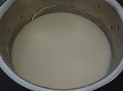 cake batter in a container for steamed eggless cake