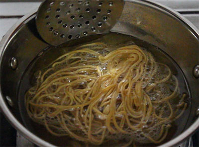 frying thin kara sev mixture or omapodi mixture