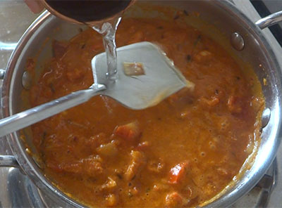 cooking tomato kurma or tomato gojju