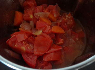 grinding the fried ingredients for tomato soup