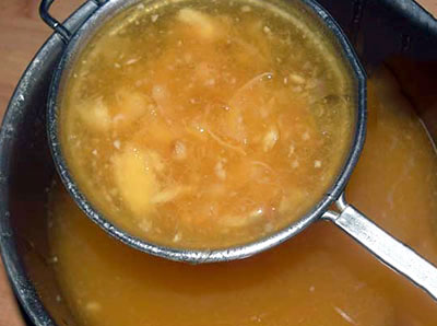 straining for belada hannina panaka or wood apple juice