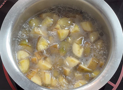 cooking raw banana for balekai mosaru kootu or raw banana majjige huli recipe