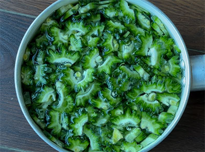 chopped bitter gourd for hagalakayi palya or bitter gourd stir fry