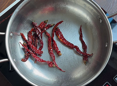 roasting red chillies for huruli kalu chutney pudi or chutney powder