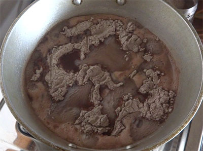 mixing ragi flour for ragi mudde or ragi balls