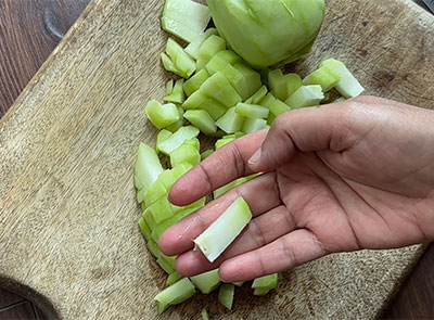 chopping chayote for seeme badanekayi gojju recipe