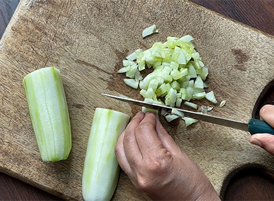 chopping cucumber for southekai mosaru bajji or cucumber raita recipe