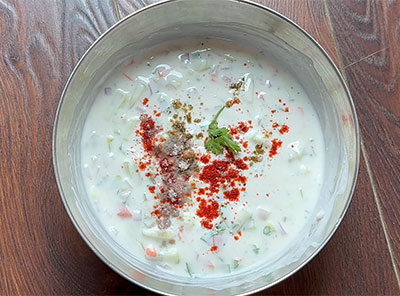 grinding coconut, green chillies and mustard for veg raita or vegetable salad recipe