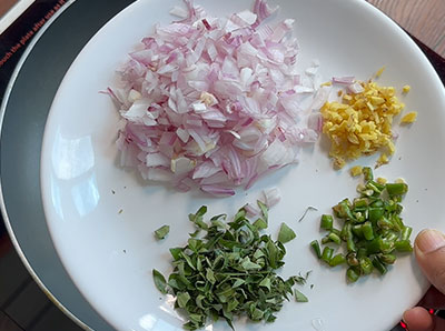 onion, ginger, green chilli and curry leaves for vegetable idli recipe